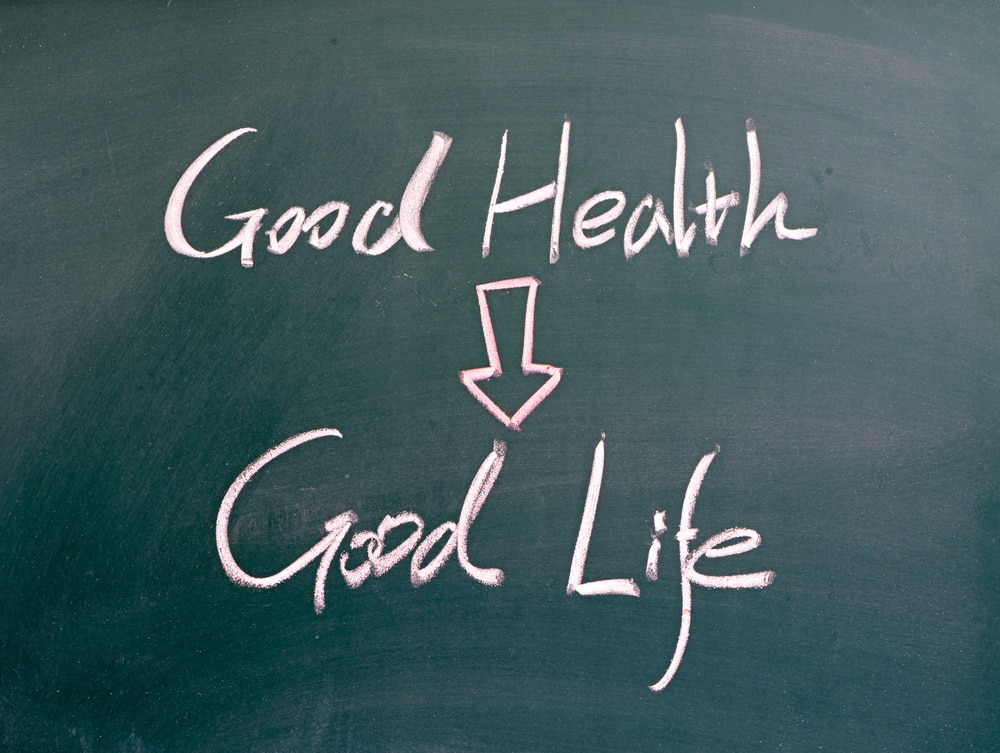 "good health = good life" word written on blackboard